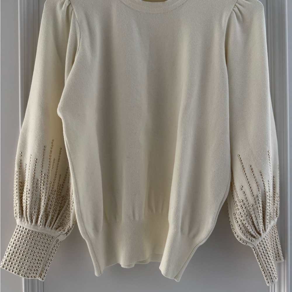 Elegant Cream Sweater with Embellished Sleeves